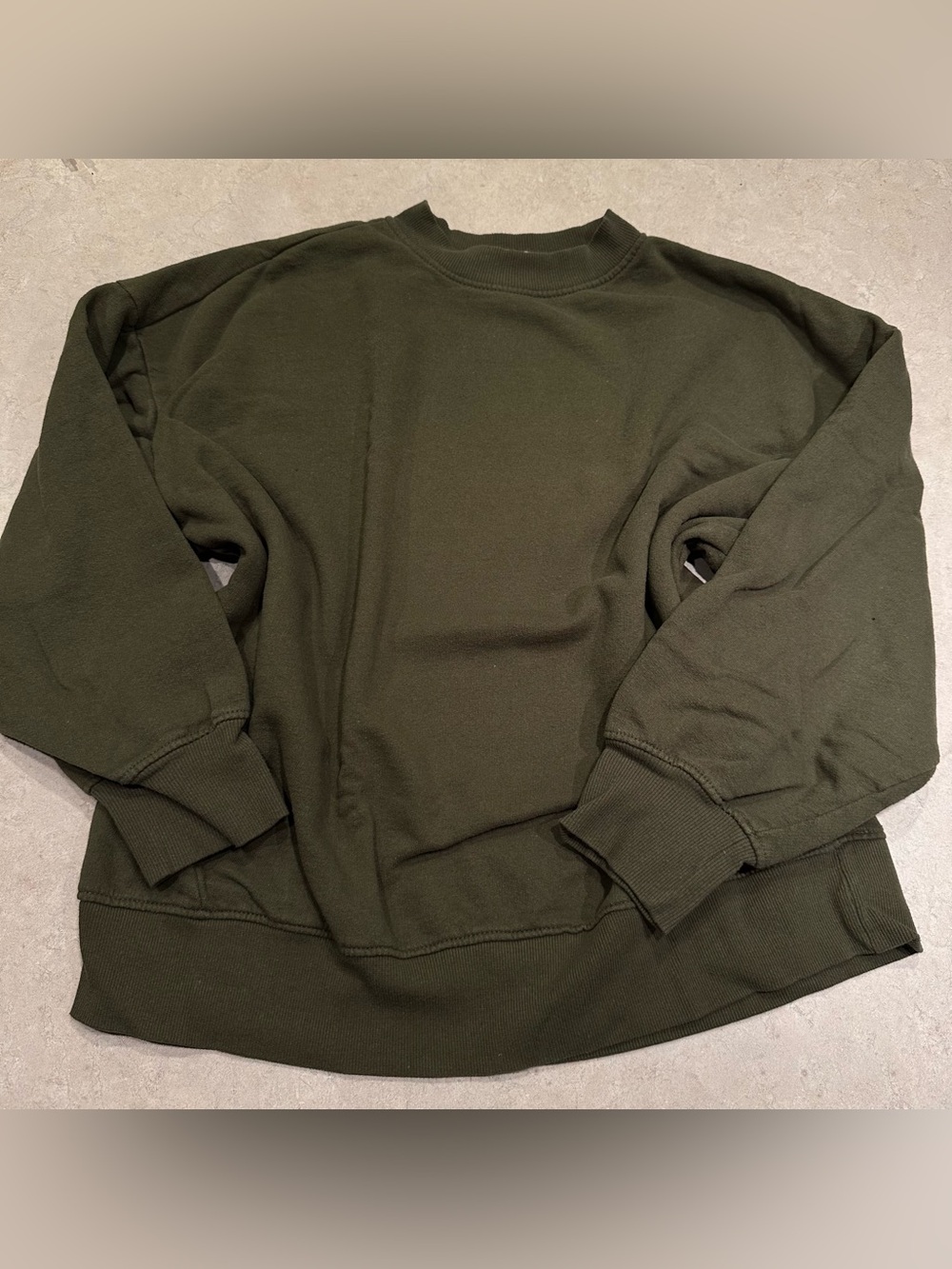 green crewneck sweater